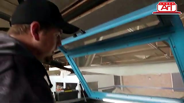 Technician at open blue TruCUT bed (SKU ask)