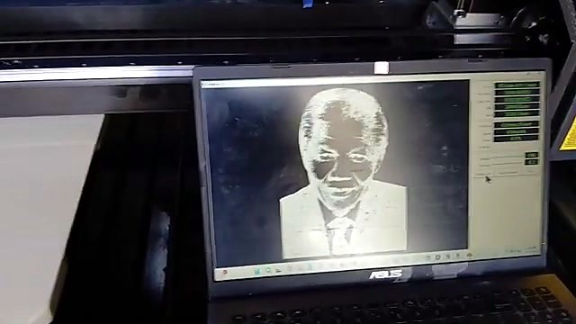 Laptop control UI with Mandela artwork (SKU ask)