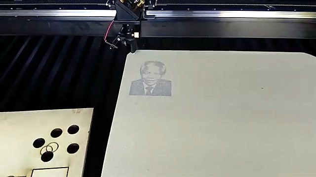 Engraving progress + wood scrap cutouts on bed (SKU ask)