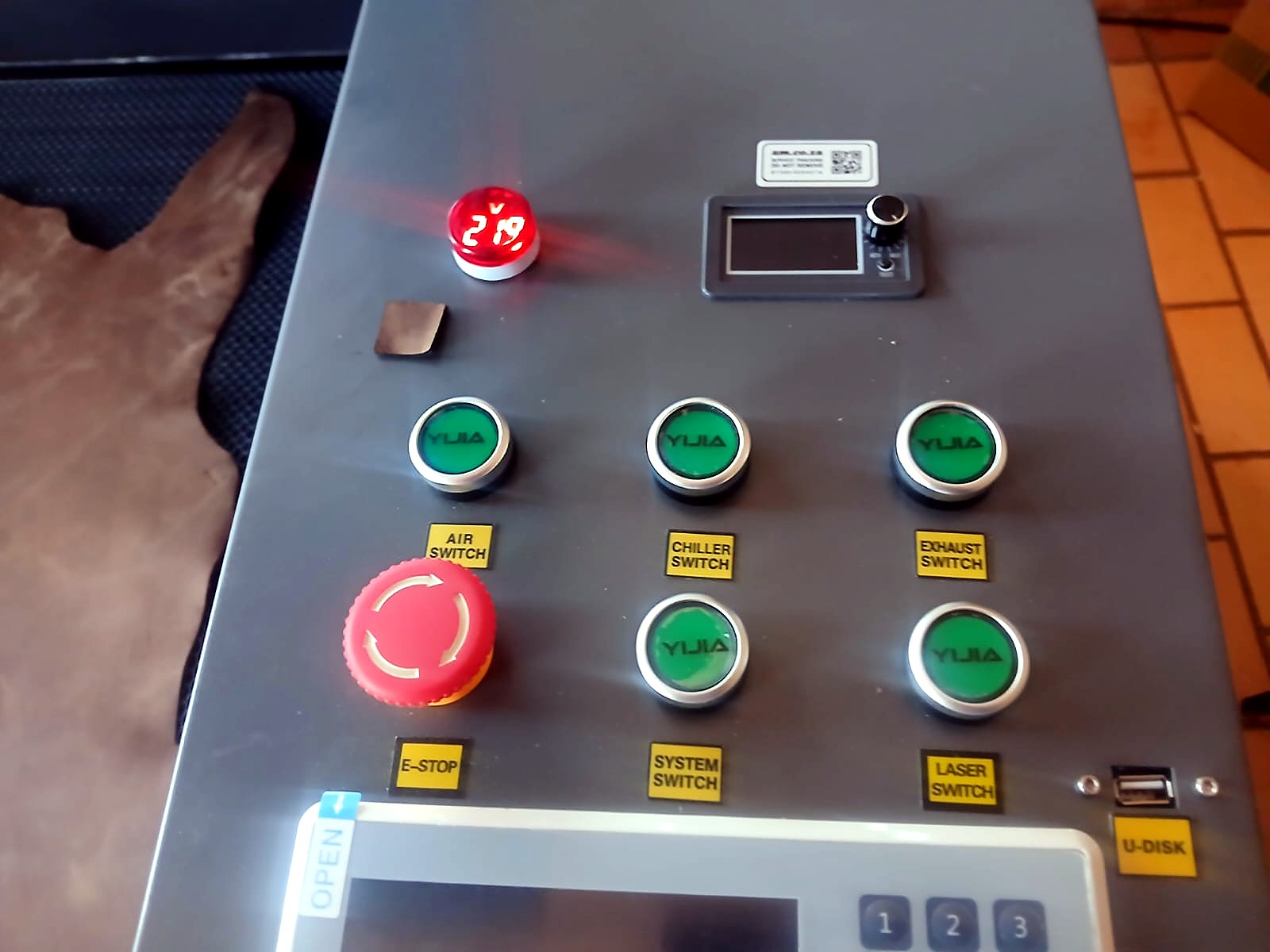 LC-1390/150: front control panel - laser/power buttons, red emergency stop, key switch, amp/temperature display and controller screen (staff still)