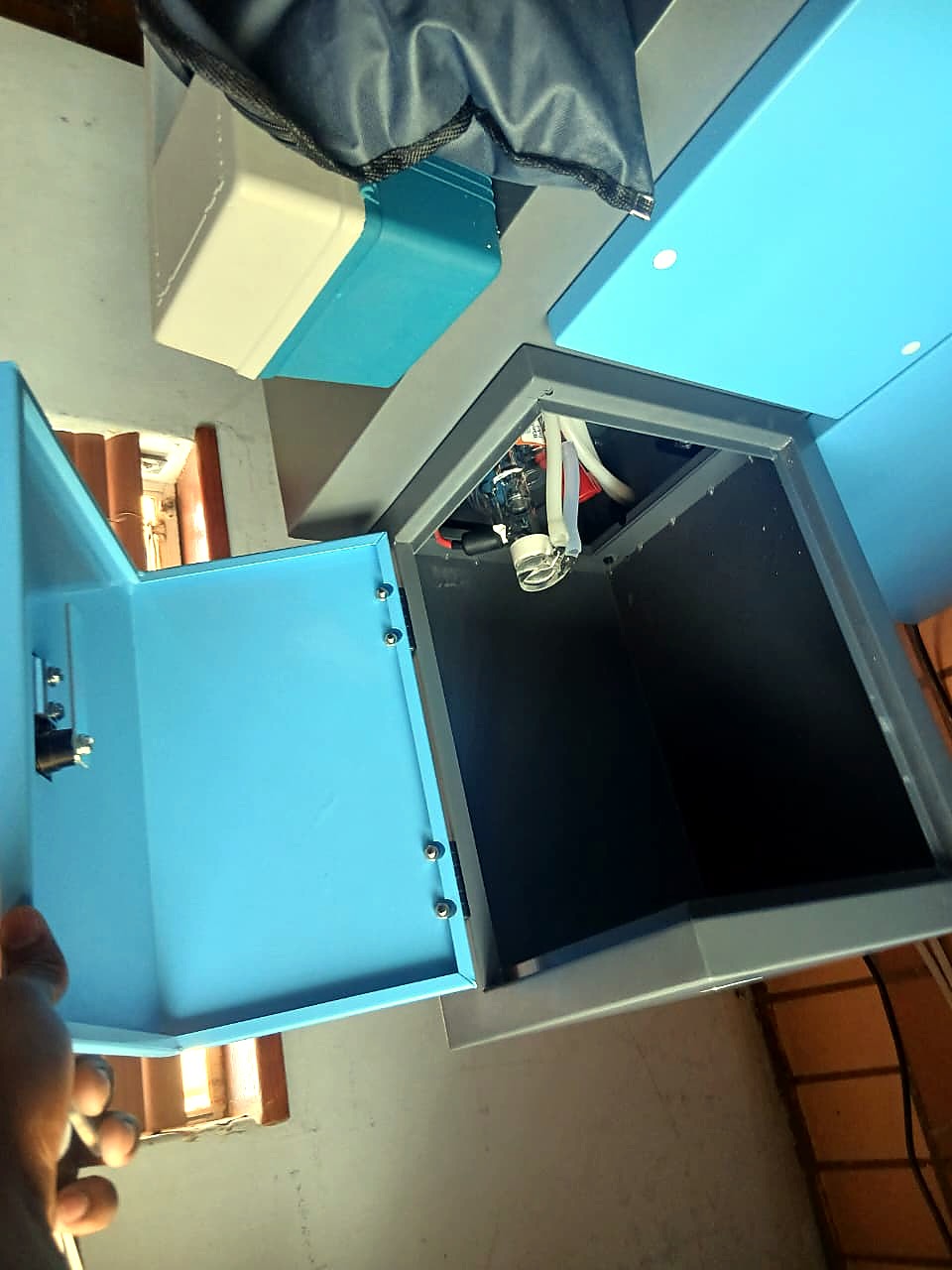 LC-1390/150: side access door opened showing the cabinet's inner bay (staff still)