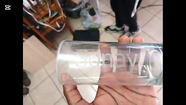 Hand holds glass with Enjoy script engrave (SKU ask)