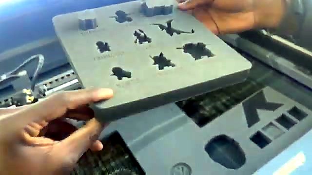 Hands hold finished Pokémon foam insert (SKU ask)