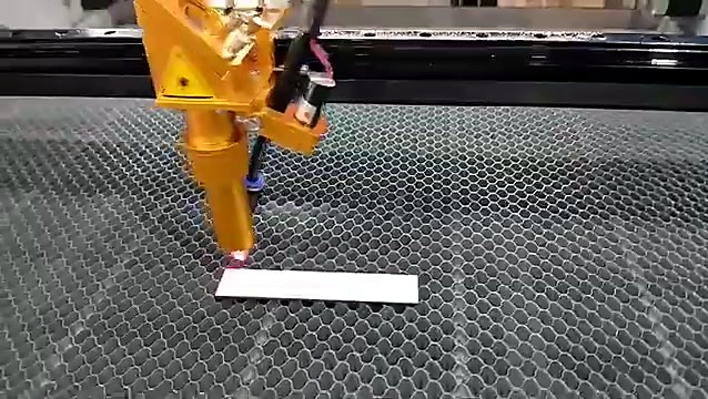 Gold laser head over honeycomb bed