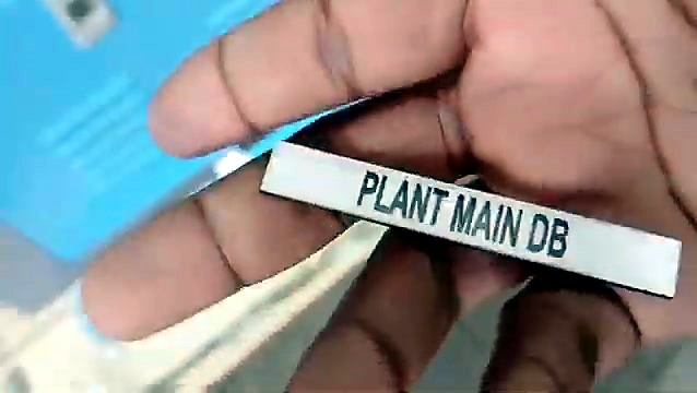 Finished engraved magnet label held in hand