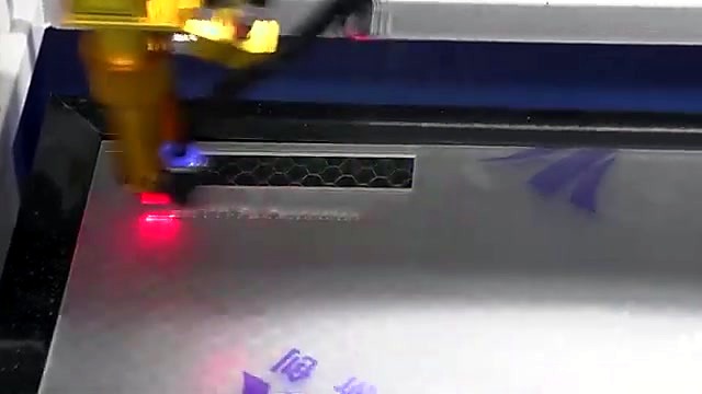 Live cut with red-dot + smoke on sheet (SKU ask)