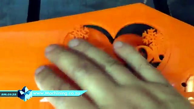 Hand with finished orange acrylic GELOO heart (SKU ask)