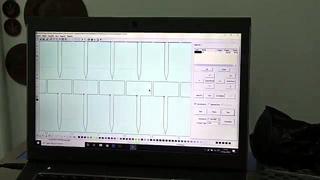 CAD nest of T-stake plant labels on laptop (SKU ask)