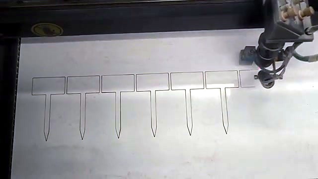 TruCUT cutting white ABS T-stakes on honeycomb (SKU ask)