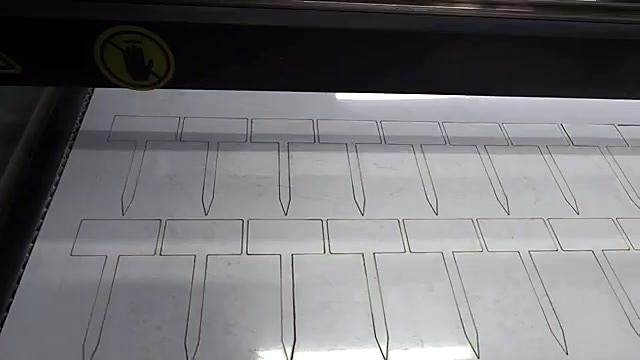 Two rows of cut ABS plant labels on bed (SKU ask)