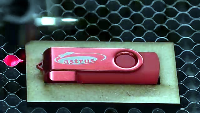 Red USB logo engraved in wooden jig (SKU ask)