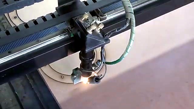CO2 nozzle cutting circular path on wood slat bed (SKU ask)