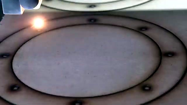 Cut wooden speaker ring still on slat bed (SKU ask)