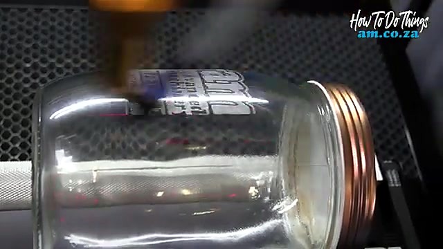 Laser engraving frosted am logo on rotating jar (SKU ask)