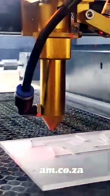 Gold nozzle cutting acrylic on honeycomb (SKU ask)