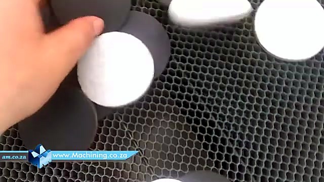 Hand removes cut disc from skeleton (SKU ask)