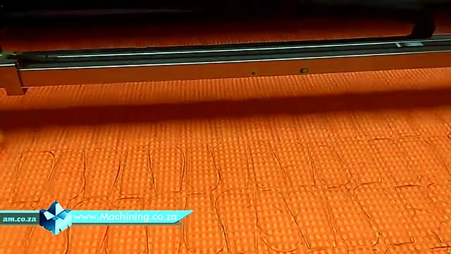 Gantry bridge cutting orange fabric (SKU ask)