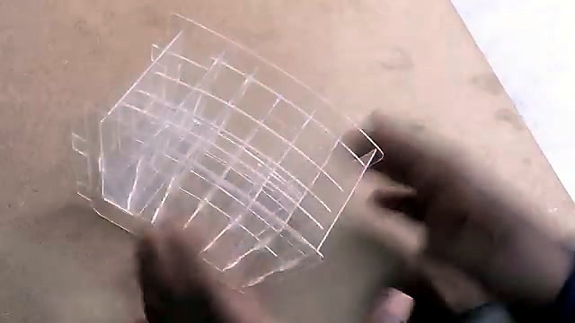 Finished clear interlocking acrylic organizer in hands (SKU ask)