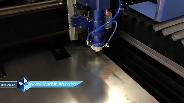 Blue metal-cut laser head over sheet metal (SKU ask)
