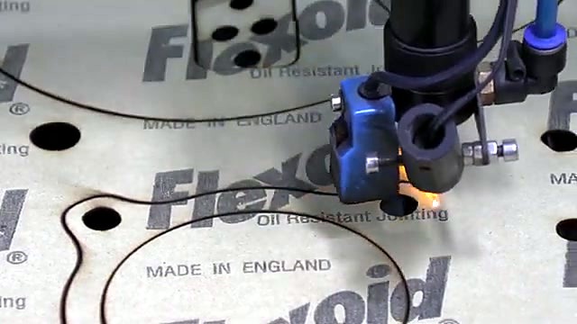 Laser head mid-cut on Flexoid gasket sheet (SKU ask)