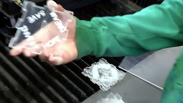Neon acrylic tab-edge cut in progress (SKU ask)