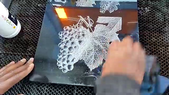 Wiping finished granite slab with blue cloth (SKU ask)