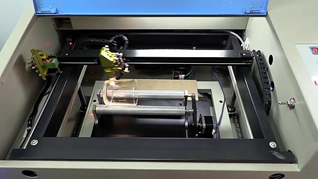 Yellow head engraving shot glass on rotary — spark (SKU ask)