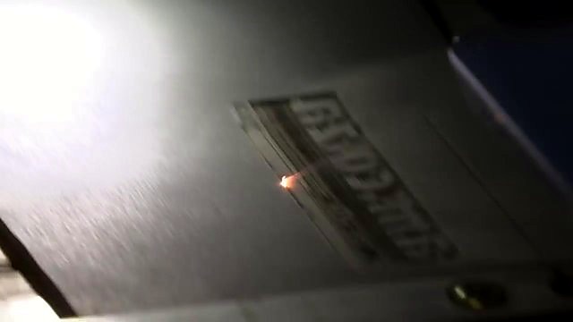 Laser engraving am.co.za logo into rubber (SKU ask)