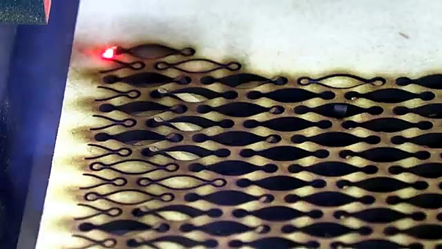 Living-hinge lattice being cut on Supawood (SKU ask)