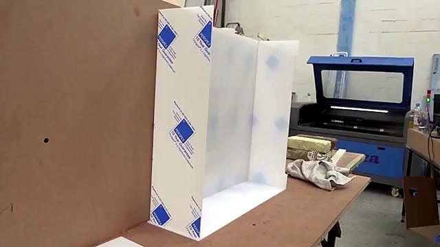 U-fold Perspex display + am.co.za TruCUT cabinet behind (SKU ask)