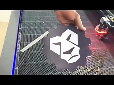 Hand holds finished AM lion-gear contour cutout (SKU ask)