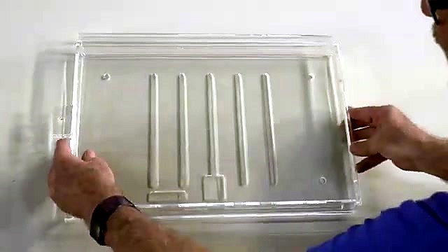 Finished clear acrylic grooved tray/display held up (SKU ask)