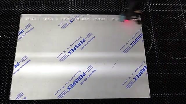PERSPEX film under laser red-dot on honeycomb bed (SKU ask)