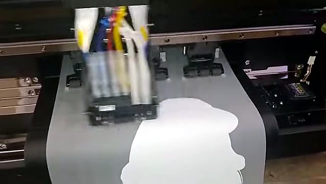 Carriage mid-print over DTF film path (SKU ask)