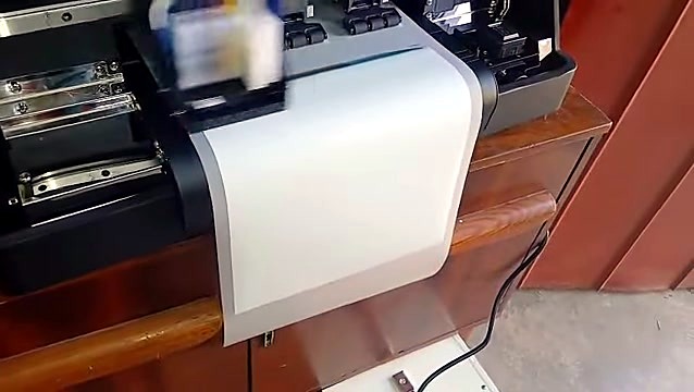 Carriage printing; white film exiting front (SKU ask)