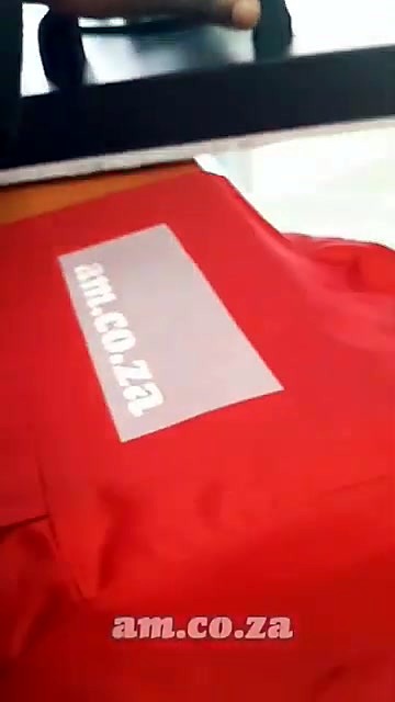 White DTF transfer positioned on red work jacket (SKU ask)
