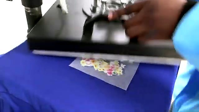 Heat press applying glitter film to garment (SKU ask)