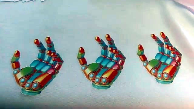 Three finished colourful hands on textile (SKU ask)