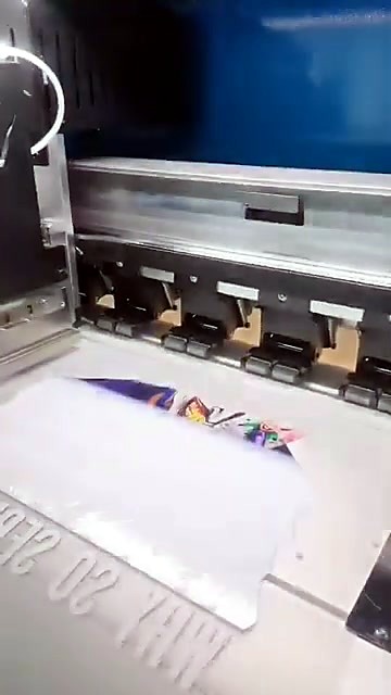 DTF printer printing Joker film on roll (SKU ask)