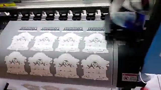 Rows of white + colour artwork printing on DTF film