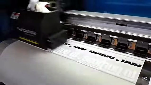 Print carriage close over DTF film with mirrored text (SKU ask)
