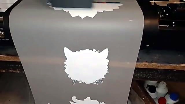 White animal-head print on film exit (SKU ask)