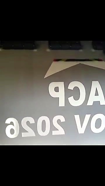 Close-up of printed DTF film showing white lettering and a star