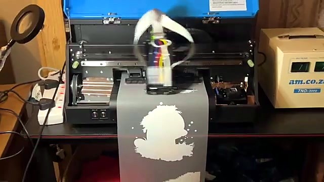 Blue lid open; film path + am box (SKU ask)