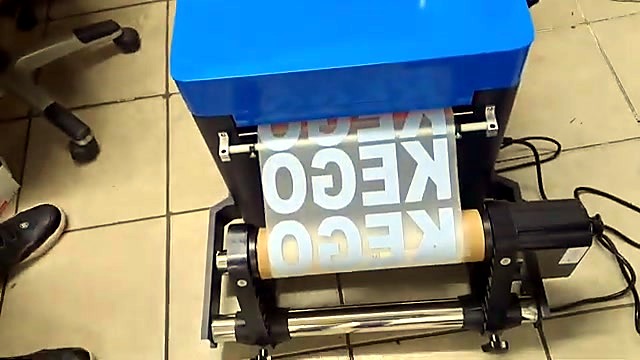 Rear/bottom film roll feed path (SKU ask)