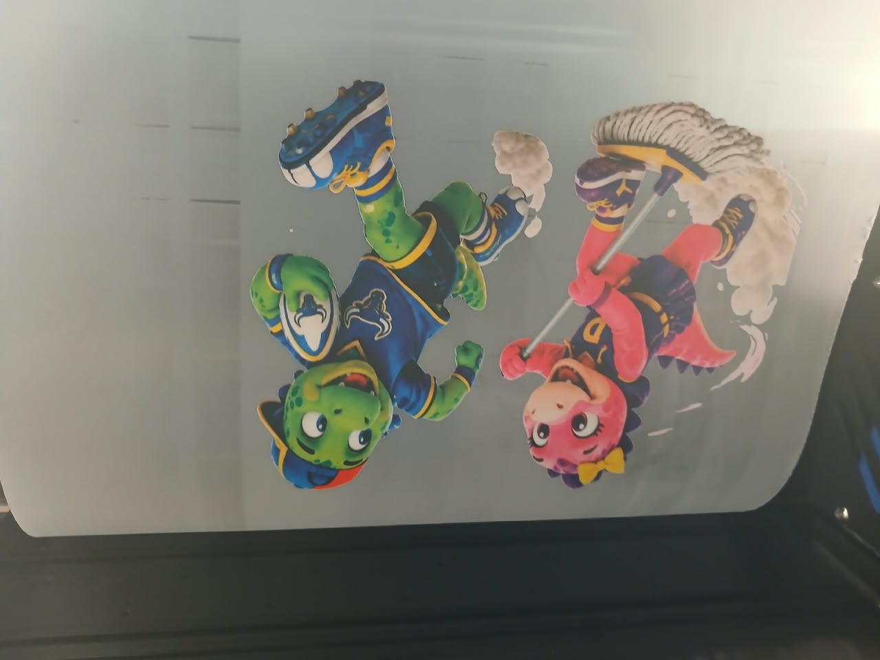 F-DTF/A3 A3 DTF: cartoon dinosaur duo print on film in machine (staff still)