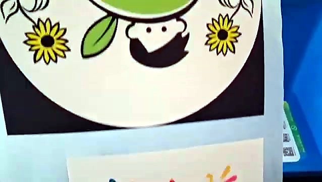 Printed design with sunflowers and a cartoon face on DTF film