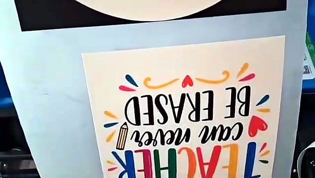 Printed DTF film with the teacher quote design coming out of the F-DTF/A3