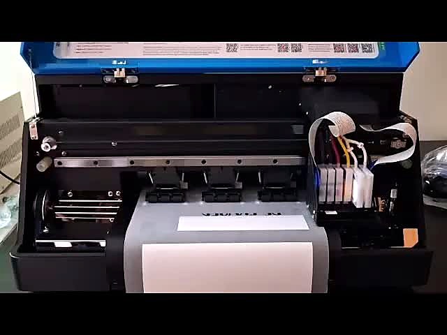 F-DTF/A3 printer with open lid showing XP600 carriage, ink tubes and white DTF film