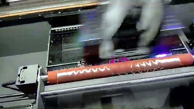 Orange tension roller + UV print head mid sticker job (SKU ask)